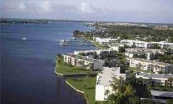 SPACIOUS & BEAUTIFULLY REMODELED AND FURNISHED (1 of the largest Circle Bay floorplans)RIVERFRONT CONDO WITH STUNNING VIEWS OF THE ST. LUCIE RIVER AND PICTURESQUE SUNSETS. BEAUTIFUL AND TURN-KEY! DECORATOR FURNITURE, ELECTRIC AND ACCORDIAN HURRICANE