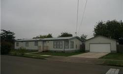 Spacious manufactured home with master bedroom and bath at one end and 2 bedrooms and 1 bath at the other. Formal dining room off living room, separate recreation room and indoor utility. Roomy 576 square foot detached 2 car garage. Large .24 acre lot