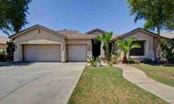 Beautiful split floorplan offers four beds and two bathrooms, family room, living room, high ceilings with plant/collectable shelves and plantation window coverings throughout. Listing originally posted at http