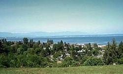 Point Roberts lot with bay and mountain views.
Listing originally posted at http