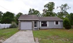 This solid home has lots of extras you are sure to appreciate. Backyard features an open patio, hardwood laminate flooring, beautiful living room w/stone accent wall, huge kitchen/dining/breakfast room w/most appliances, light and bright bedrooms, and a