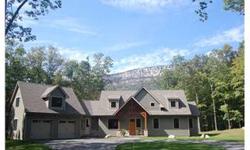 "Breathtaking" describes this custom architect designed Post & Beam home with magnificent mountain and water views.This private paradise is tucked away on 6 acres and is boarded by a 350 acre estate and overlooks a large pond, has breathtaking ridge views