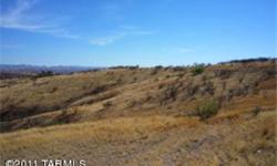 This high view lot is ready to build on, including building pad. There is a good well (no pump) and a perc test was done a few years ago. Wonderful privacy and views of the mountains and Nogales City lights. Easy access to Nogales and just off the main