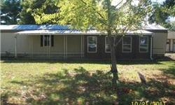 Spacious modular home built in 1985, 2 br, 1 bath with laundry room and wood built in cabinet and nice wood cabinet in kitchen! The garage offers lots of space. Great lot, .32 acres! PROPERTY TO BE SOLD "AS-IS". ALL OFFERS SUBJECT TO CORP/INVESTOR
