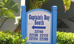 This Captains Bay South 2-bed, 2-bath, turnkey, corner unit condo is a gem with a quiet and serene view of the waterway and preserve. Peace and quiet. This unit offers the maximum lighting. The sizeable entryway (65 square feet) is fully tiled with 16 dia
