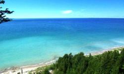 Sunrise views over North Lake Leelanau and Sunsets over Lake Michigan come with this lovely estate size parcel in Leland Township and just 2 miles to the quaint village of Leland. Sandy beach front on North Lake Leelanau and steps to Lake Michigan are