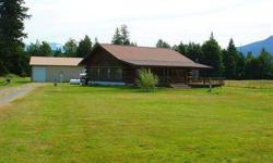 Well cared for log home on 5 fenced acres in Birdsview offers wonderful 360 degree views...perfect location for your dream horse property. Additional features include two RV hook-ups, pasture for horses w/room for more, 4 stables, 36' x 60' heated shop