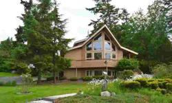 Custom built lindal cedar home with wood wrapped window unobstructed views of the Straits of Juan De Fuca. The corner lot fronts on two streets and itprovides some privacy with wild roses and large lot beautifully landscaped. Circular drive for ease of