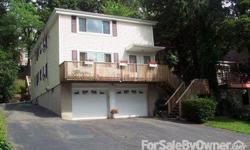 WATER VIEWS! Exceptional Two-Family Home in desirable single family neighborhood, one block from Long Island Sound. Each floor includes 2-3 bedrooms, 1 bath, dining room, large living room and kitchen. House has a beautiful front wood deck (with views of