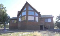 Be King of the Hill - Attractive 2BR/2BA (1697 sq ft) chalet style home on an .85-AC hill top lot. Full wall of windows, wood blinds throughout & slate stone gas FP w/unique wood mantle. Split BR plan plus a 300sf loft w/a private balcony with long-range