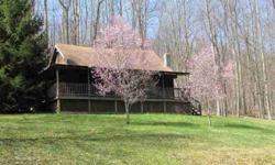 PRIVATE CABIN LOCATED ON 70 WOODED ACRES BORDERING THE NATIONAL FOREST NEAR THE HEAD OF BECKYS CREEK. THIS IS A RARE FIND INDEED!!! NICE 3 BEDROOM 2 BATH 1.5 STORY WOOD SIDED CABIN WITH LARGE WRAP AROUND DECK AND SECOND STORY BALCONY. LAND IS MOSTLY