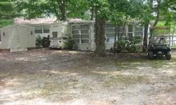 My clean and cozy lake house trailer is perfect for vacations, get-a-ways, or to live in from April-November! It is situated right on the lake with a fantastic view. The lake is clean and man made. The Bell Haven Resort complex has security guards on site