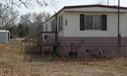 GREAT INVESTMENT POTENTIAL! Perfect rental, downsize or first home. This 1977 single wide on a double lot might be the one, there is plenty of room to let your imagination (or whatever) run wild. Don't let this pass you by. Two contiguous lots with 1977