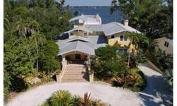 Extraordinary, one of a kind Manatee River Treasure. You have to see this home to appreciate its character and attention to detail. There are too many extras to list. This gorgeous custom built, architect designed, old Florida riverfront home is nestled