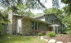Charming Wood Contemporary in the town of Cedarburg nestled on 1.5 acres. Fenced yard with deck. Many updates. Kitchen has new Corrianne Counters, new tile flooring,hardware,microwave.Newer dishwasher. Newly painted thorough out. Beautiful hardwood floor
