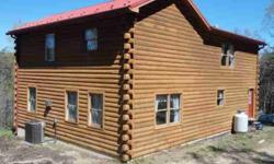 Amerlink Log home on 26.84 acres located approximately 5 miles south East of Keyser Metal roof and front deck.2 large bedrooms on second floor with 2 baths.Front foyer and rear mud room. 1 bedroom on main floor.Large family room with gas fireplace