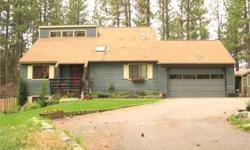 Private location on a cul-de-sac in pine filled subdivision. Interior of home is filled with natural light. Wood stove makes the living area cozy. 4 bedrooms, 2.75 baths. 2 bedrooms on the main floor. The deck is plumbed and wired for a hot tub. Ponderosa