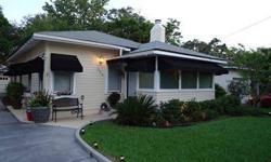 Meticulous 1925 Bungalow, lovingly restored in Downtown Orlando's Park Lake Highland neighborhood. 2/2 completely updated with many original element's remaining. Gorgeous black awnings, Wood floors, crown molding throughout, track lighting, new windows,