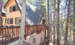 Fantastic cabin near Golf Course sold TURNKEY Furnished & has Amazing Mtn. Ambiance. Features a relaxed feel with vaulted ceilings, rock fireplace, 2 bdrms on main level, private loft master-suite, huge lower level family room with many upgrades plus a