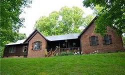 SCOTT DEPOT- Absolutely WONDERFUL home in a park-like setting on 4.5 ACRES! Cedar & brick exterior. HDWDs thru-out, ceramic kitchen & baths. Spacious kitchen. Gracious Master suite with a wood-burning stove & private screened deck! Shady front porch and