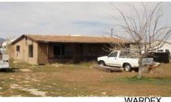 Value is in the land, septic, and utilities. Zoning is R11A per Mohave county. Great location to either repair the existing building, build new or set a manufactured home. Go take a look and see what you think, any thing is possible! The county record
