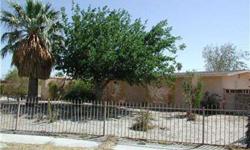 Excellent potential is available with this fixer. Basic 3 BR /2Ba stucco home on fenced in lot. Desert landscaping with a variety of plants and trees. This is a corporate owned property, sold as-is. For special financing and incentives, Seller requests