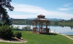 Deeded R.V Resort Lot,Amenities include, Elegant 10,000 sq ft Lodge w/indoor swimming pool, hot tub, sauna, exercise facility, game room, laundry, & meeting room. Secondary access to the Pend Oreille River with 55 miles of fishing, water skiing and sight