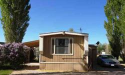 two Beds, two Bathrooms mobile home sits on large, beautifully landscaped lot with lots of mature trees and beautiful lilac bushes. Great for vacation getaway, as well. NOTE