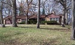 Spectacular location!! Huge, heavily wooded hilltop lot (almost 1.4 acre) on a quiet cul-de-sac. Gracious living room with fireplace. Recently remodeled full bath. Screened porch. Perfect for retirees looking to downsize or first time buyers. Walk to
