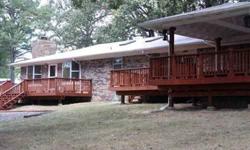 Featuring two bedroom suites and two bedrooms for a total of 4 bedrooms and 3 bathrooms, this rambling ranch-style home has plenty of space for the whole family. 2900 square feet single-level on 33 acres of pine, deciduous forest, a budding orchard,
