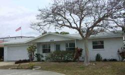 Directly across from the Gulf of Mexico. A wonderful family home or a great investment property on the beach. 2 bedroom 2 bath double garage. Living Room, Florida Room and tiled floors throughout. Fresh paint, ceiling fans in each room. sliding glass