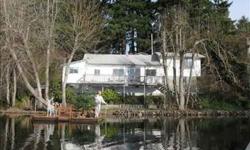 Lake front property located right on Offut Lake. Aprox 90' lake frontage. Located on 1.13 acres with private dock. Property level with wooded area/cleared. Home features master bedroom w/half bath. Living room with wood fireplace. Bonus room/shop with own