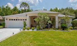 Located on a private lot overlooking a wooded conservation area in the prestigious gated community of Spruce Creek Fly In, this lovely home was built by the respected local builder, the Johnson Group. Featuring 4 bedrooms and 2 baths, you will enjoy the