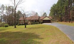 Beautiful. level waterfront lot is over two acres with a picture perfect view of the fishing lake. Spacious home has been well cared for by this sweet couple. Two living areas, large sunroom, office, sewing or hobby room, three bedrooms, three bathrooms,