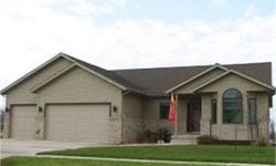 4BR 3BA Ranch in Nevada, IA, Built 2005, 3550 Total Sq Ft (1920 Main & 1630 lower), 3 car garage, solid oak 6 panel doors throughout, custom walk-in shower with multiple heads, gas fireplace, 2 decks, professionally designed landscaped yard, kitchenette &