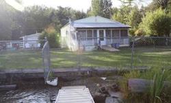 70 feet flat level lot with "no-bank" frontage. Diamond Lake waterfront home. Level lot with no steps to the water. Grass to sandy beach and the lake front. Dock. Fenced year. Detached bunkhouse. Diamond Lake water and sewer. Low cost PUD