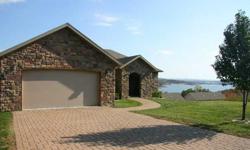 from this 4BR/3BA/3090sqft Luxury home in Branson. Open Soaring Ceilings Great room to Kitchen, designed for entertaining. Stone wall with fireplace, tile floors. Upscale luxurious features on both levels. Master Bedroom on main level. Formal Dining room
