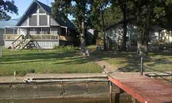 2 bedroom 2 bathroom one and half story true lake house. Plus 1 bedroom 1 bathroom full guest house on two open water southern facing gorgeous lake lots. Oversized boathouse, storage building and unlimited potential. Come See!Listing originally posted at