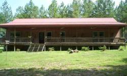 44 acs, mostly in planted Long leaf and Loblolly pines. 1,000 ft. paved road frontage. 2000 sq. ft. 3bd/2ba energy eff. Ranch home, open floor plan, hardwood floors, stainless kitchen, 9 ft ceilings, rocking chair front porch. 1 bd/1ba updated cabin by 2