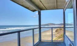 FABULOUS OCEAN FRONT BEACH RETREAT designed for optimal ocean viewing from world class sunsets to jetty & lighthouse views. Big 2 level corner unit boasts a fantastic master suite w/jet tub & fireplace. Large covered glass railed deck for enjoying the