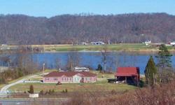 Beautiful Ohio River estate on 7 scenic acres over looking the river. The home is located on level high ground above flood stage with private boat dock on the river. Additionally the property has a shelter with summer kitchen, multiple camper kook-ups,