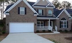 Beautiful 4BR/3.5BA brick home. This Essex Remington II floor plan has a front porch & back deck & is built on a beautiful lot. This home features elegant 2 story foyer & family room w/fireplace. Hardwoods in the foyer & dining room, tile in all