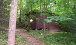Privacy is afforded here! Beautiful woods, open meadow, spring-fed Koi pond, charming cottage, and barn with 3 stalls. Nature lovers, bird watchers, artists, equestrians - all will fall in love with this 17.39 acres of Western Maryland "paradise." There