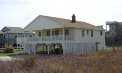 This is a classic cottage between the highways in Kitty Hawk. Beach Access is very close and the beach is great...easy walk. Some ocean views from the front covered porch. H Floor plan is family friendly. 2 bedrooms and a bath on each side of the home and