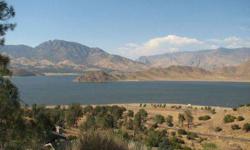 Rare yankee canyon 1.13 acre lot on paved road with awesome lake views.