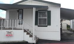 Two bedroom two bath manufactured home in low space rent community located in Santee. Vaulted ceilings, drywall, dual pane windows, ceiling fans, central air, skylights and more. Small front porch, large storage shed. Quiet all age community close to