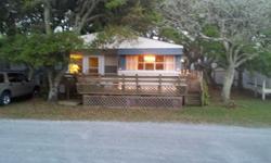 14 x 70 single-wide, 3BR, 1 and half bath mobile home with large fixed addition, located on leased lot in beautiful Island Oaks sound view community with pier and boat ramp. 10-minute boat ride from Cape Lookout, Shackleford Banks, and Beaufort