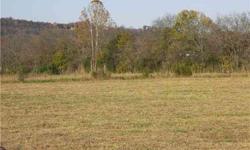 REDUCED$20,000! BACK ON MARKET! QUIET LOT IN COUNTRY WITHIN MINUTES-COURTHOUSE..88 AC 6-BDS PERK SITE! Bring builder/get site today. Location is great, min. from I-65 N/S. Wonderful schs/ Sits on knoll -fine view. Call for details today! TAXED AS