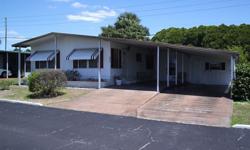 This attractively priced 2 bedroom/2 bath double-wide mobile home is situated in Spanish Trails Village, one of Zephyrhills more popular and well-established subdivisions. It is not a rental park and there is no lot rent to pay. Only your low monthly