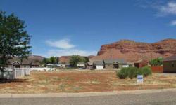 This very nice building lot is located in a great area of Kanab with beautiful views of the Vermillion Cliffs. You can build a starter home or your dreamhouse on this 1/4 acre parcel. All utilities are available at the lot PLUS you will be connected to